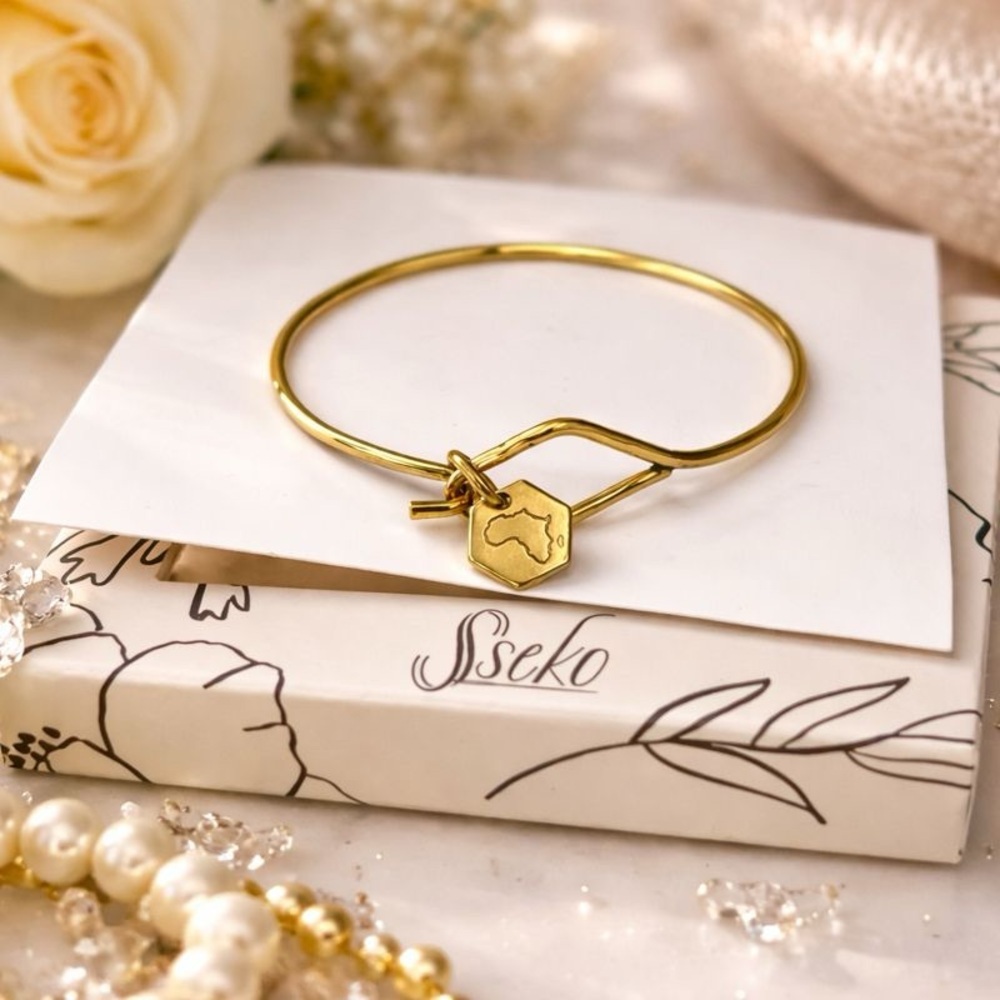 Sseko African Artisan Gold Bracelet With Charm of Africa